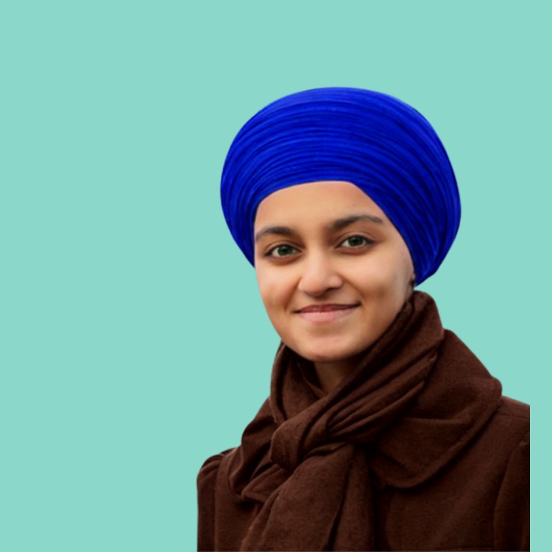 A practitioner in a blue head covering with a quiet, composed expression against a neptune background