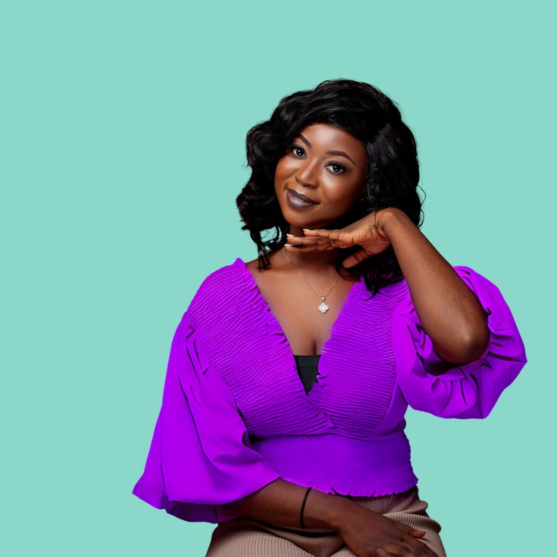 A joyful practitioner in a vivid blouse with an expressive, energetic presence against a neptune background